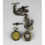 A silver cased key wind lady's half hunt in case fob watch with an unsigned gilt cylinder