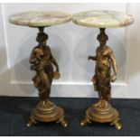 A pair of gilt metal and onyx figural side tables circular top on classical figure support to