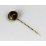 A Victorian gold and enamelled stick pin designed as the head of a dog signed to the back 'J W