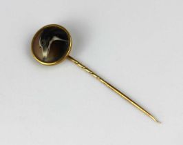 A Victorian gold and enamelled stick pin designed as the head of a dog signed to the back 'J W