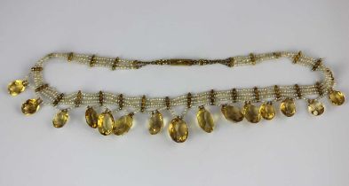 A gold citrine and seed pearl necklace, probably Indian, formed as a multiple row of seed pearls