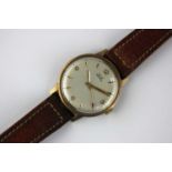 An Astral 9ct gold circular cased gentleman's wristwatch, the signed silvered dial with gilt