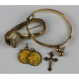 An Everite 9ct gold cased lady's wristwatch on a gilt metal bracelet, a 9ct gold pendant crucifix, a