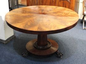 A mid 19th century mahogany breakfast table, the circular hinged tilt-top with radiating segmented