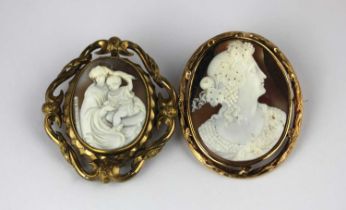 A Victorian gilt metal mounted oval shell cameo brooch carved as two classical figures glazed with a