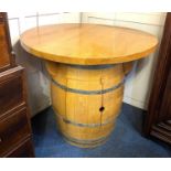 A novelty barrel breakfast / bar table with circular top on metal bound coopered barrel with