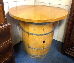 A novelty barrel breakfast / bar table with circular top on metal bound coopered barrel with