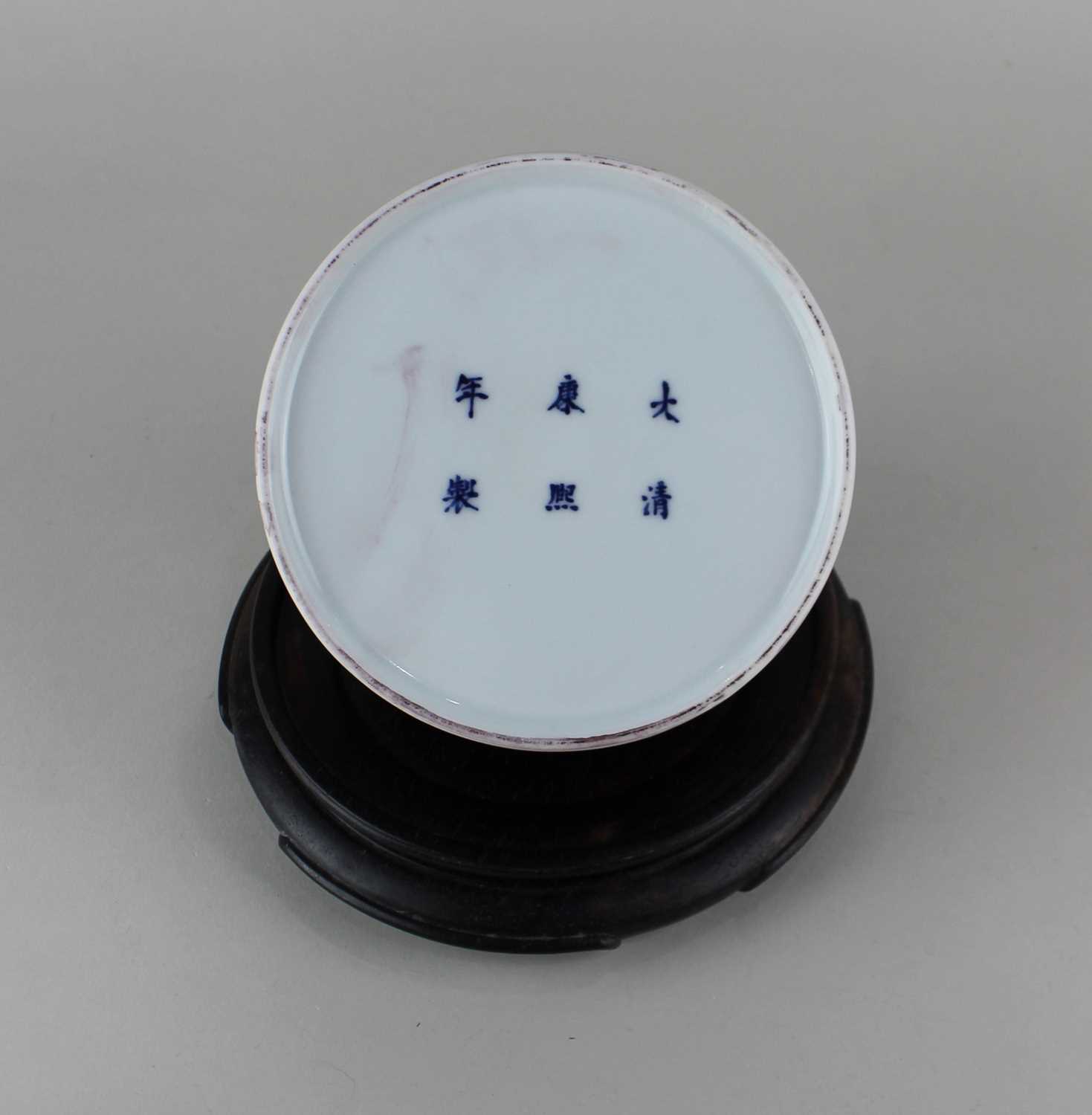 A Chinese sang de beouf glazed porcelain vase, character marks to base, 10cm high, on associated - Image 2 of 2