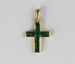 A gold and emerald pendant cross mounted with circular cut emeralds, detailed '18k', gross weight