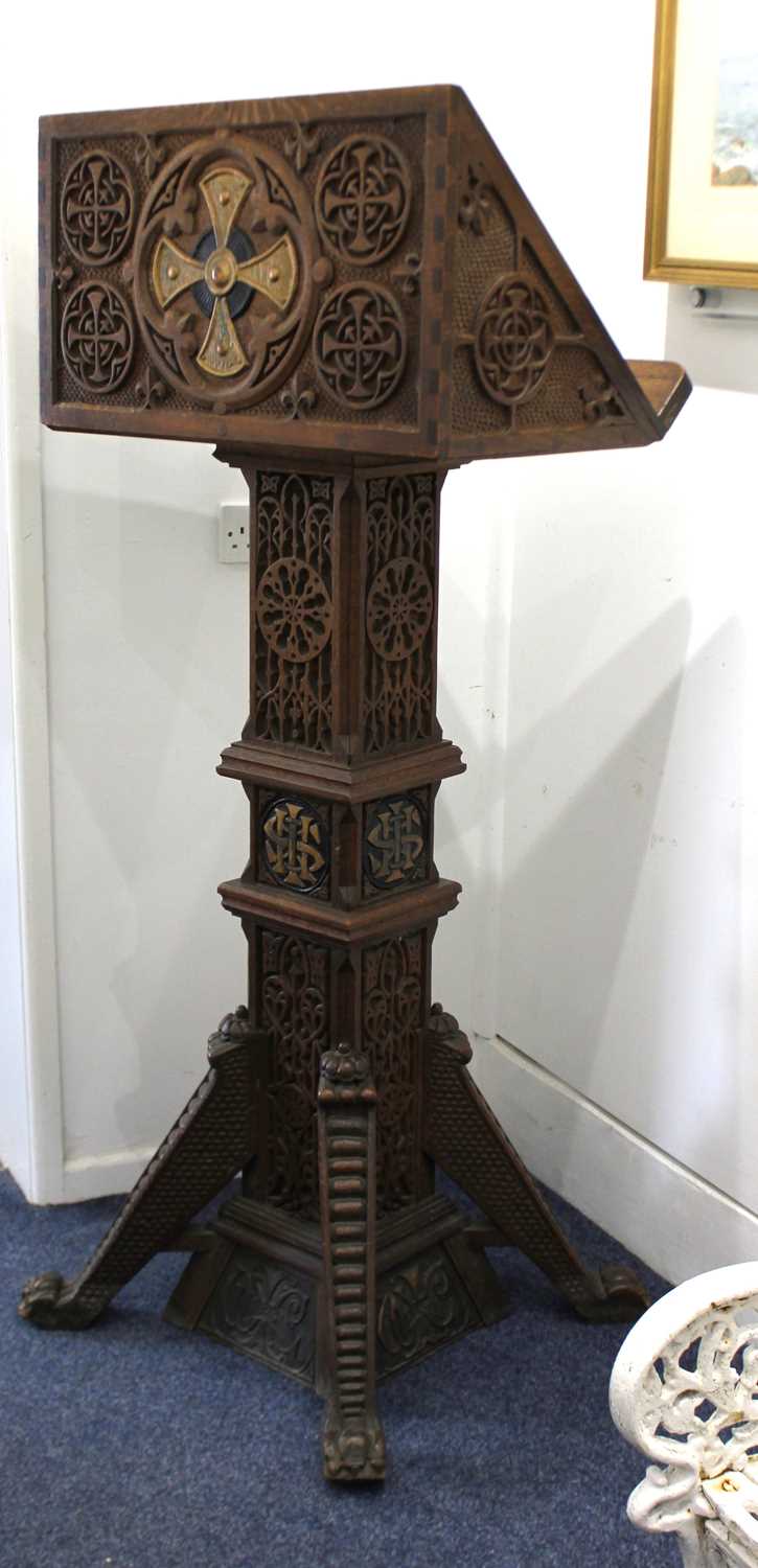 A superb Arts & Crafts carved oak Lectern in the Aesthetic taste, dated 1924, profusely carved