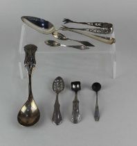 A collection of Dutch silver spoons to include a sifter teaspoon, a ladle, four cruet spoons and a