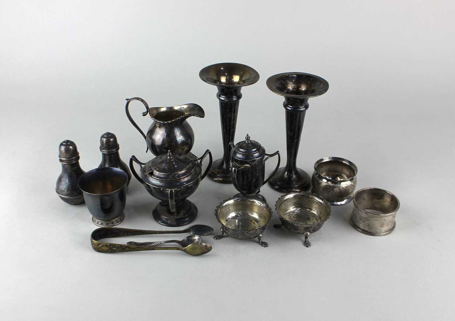A George V silver three handled mustard pot and matching pepper pot, maker Watson & Gillott,