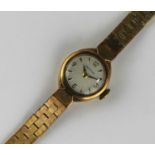 A Certina 9ct gold cased lady's bracelet watch, the signed circular silvered dial with gilt Arabic