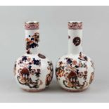 A pair of S Fielding & Co 'Indian' pattern bottle vases, with butterfly and floral decoration and