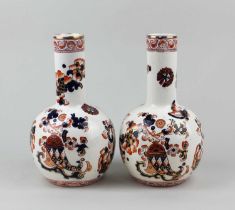 A pair of S Fielding & Co 'Indian' pattern bottle vases, with butterfly and floral decoration and