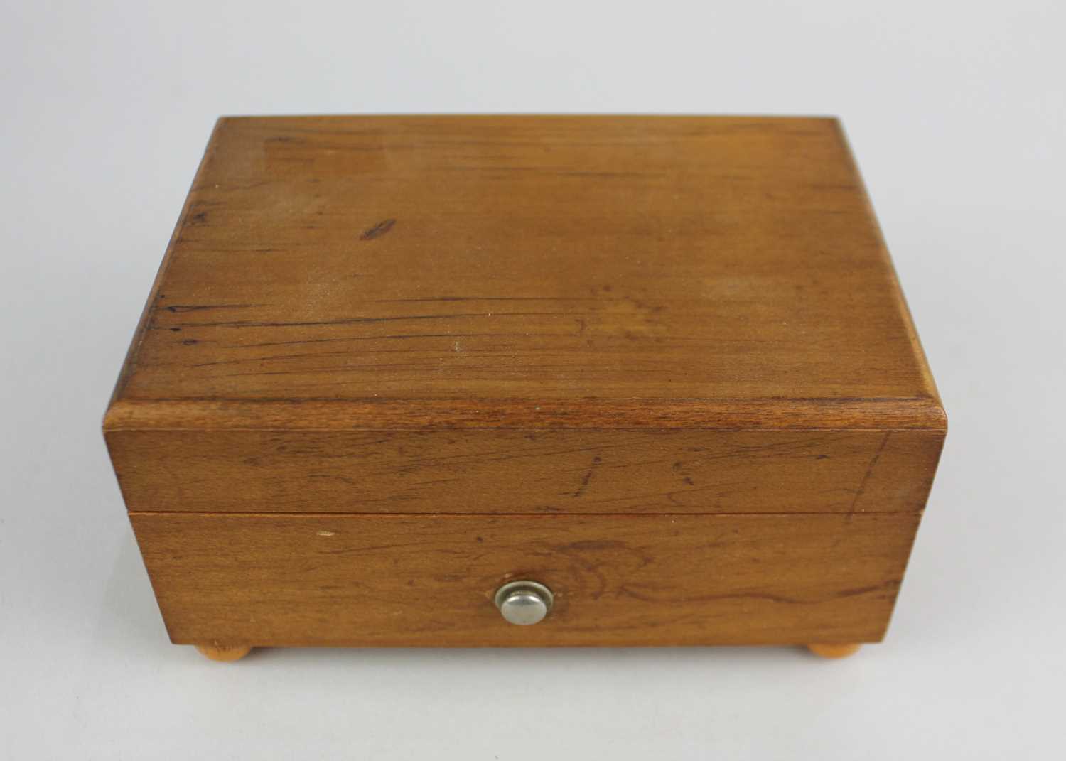 A Swiss small music box in plain rectangular wooden case with slide button switch, label beneath ' - Image 2 of 3
