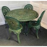 A green painted metal circular garden table and four matching chairs, diameter 104cm