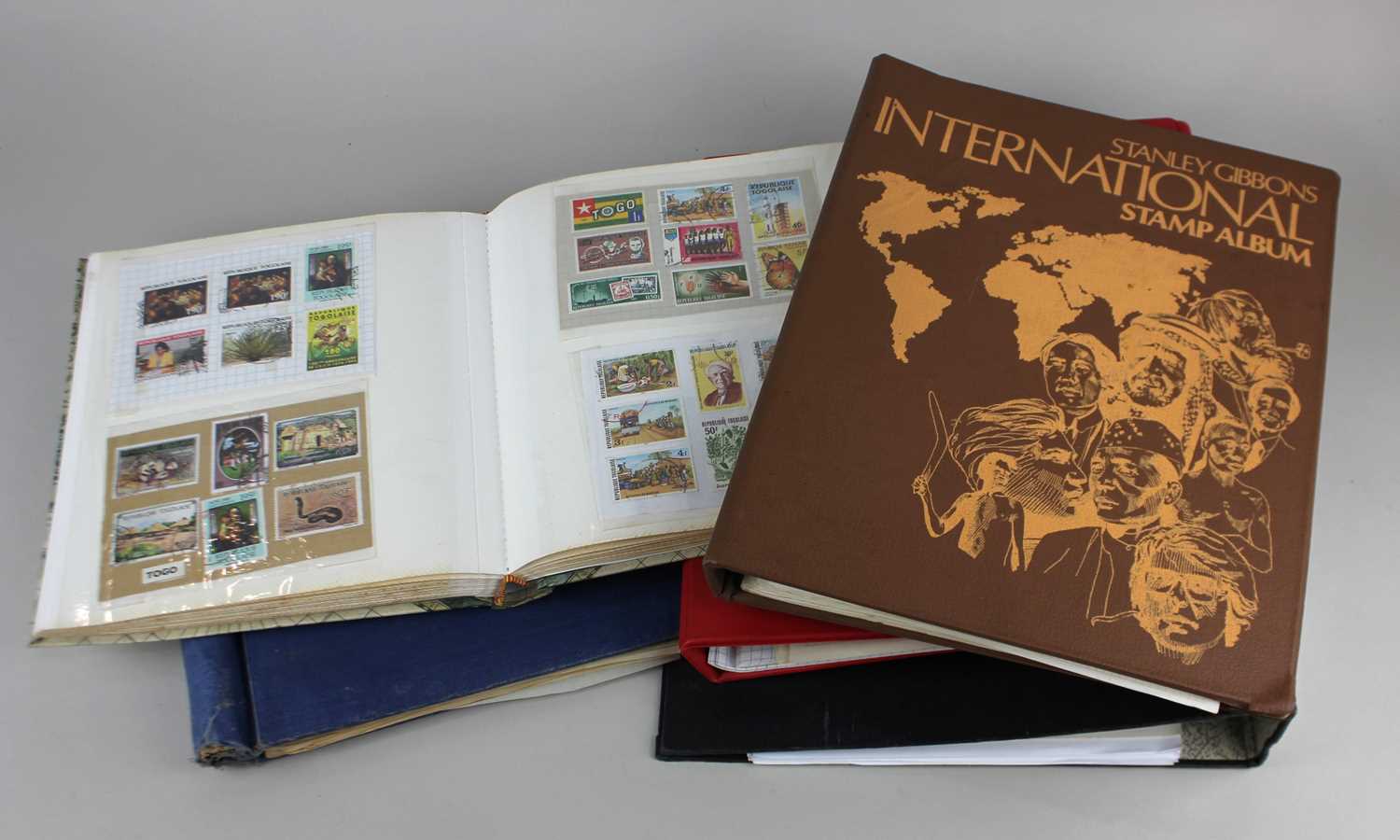 Five albums and files of British and World stamps to include Stanley Gibbons International Stamp