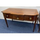 A Sheraton style mahogany breakfront side table, with an arrangement of three drawers on square