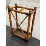 A Victorian Aesthetic bamboo stick stand with brass caps and corner mounts and metal tray (a/f),
