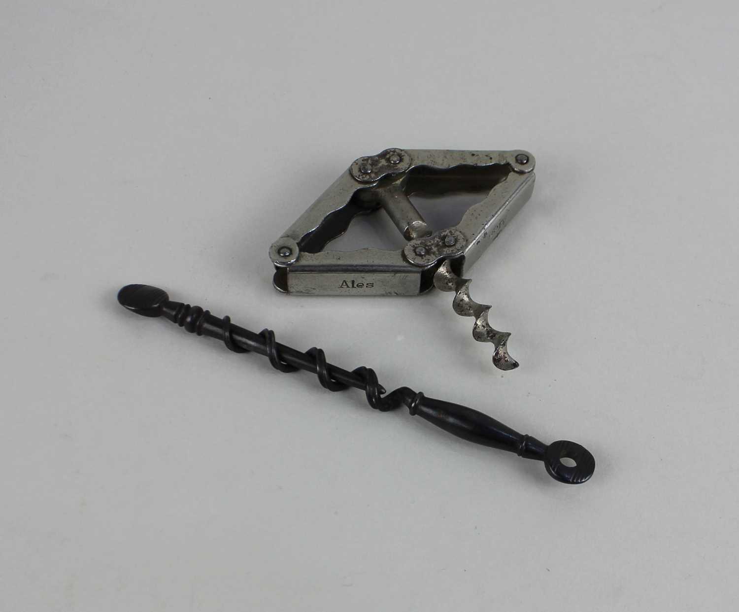 A George III steel peg and worm corkscrew and a Hollwegs patent Worthington Ales corkscrew