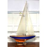 A 'J class' pond yacht based on JK4 Endeavour launched 1934, on stand with reel, (a/f radio controls