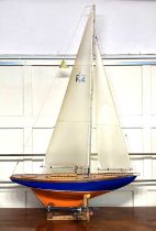 A 'J class' pond yacht based on JK4 Endeavour launched 1934, on stand with reel, (a/f radio controls