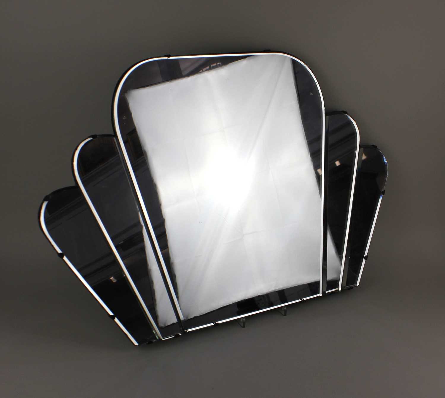 An Art Deco fan shaped wall mirror with bevelled mirror plate 72cm wide