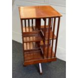 A small mahogany revolving bookstand with square top and slatted sides, 38cm