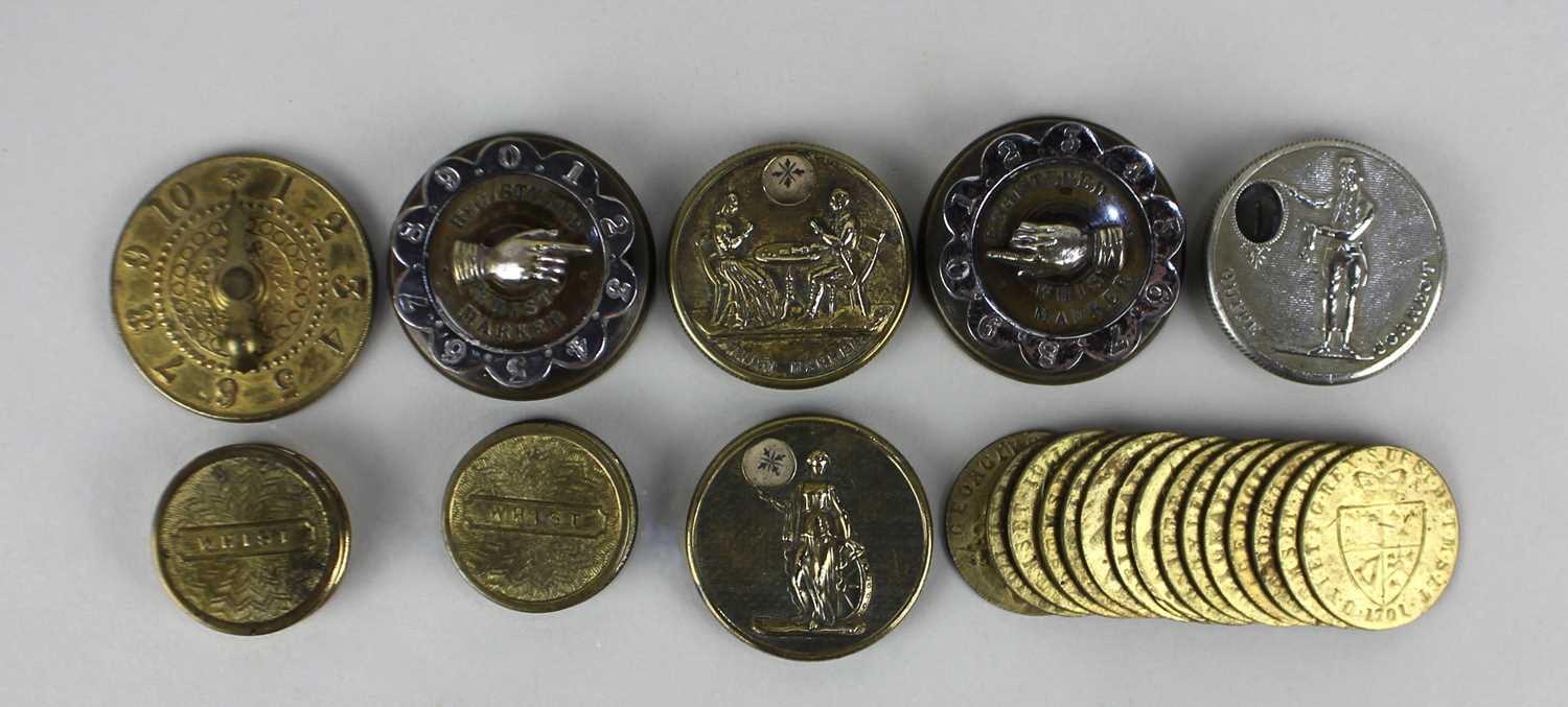 A collection of metal whist markers, some with finger pointers, together with a small collection