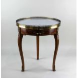 A Louis XV style gilt metal mounted occasional table with circular marble top above a drawer on