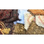 A collection of eleven decorative scatter cushions, including Persian rug designs, petit point, etc,