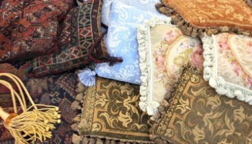 A collection of eleven decorative scatter cushions, including Persian rug designs, petit point, etc,