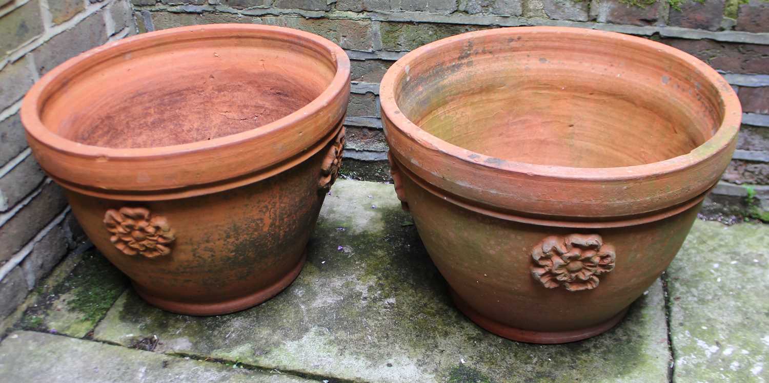 A pair of terracotta garden planters made for the late Queen's Coronation in 1953, both decorated in