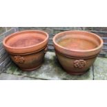 A pair of terracotta garden planters made for the late Queen's Coronation in 1953, both decorated in