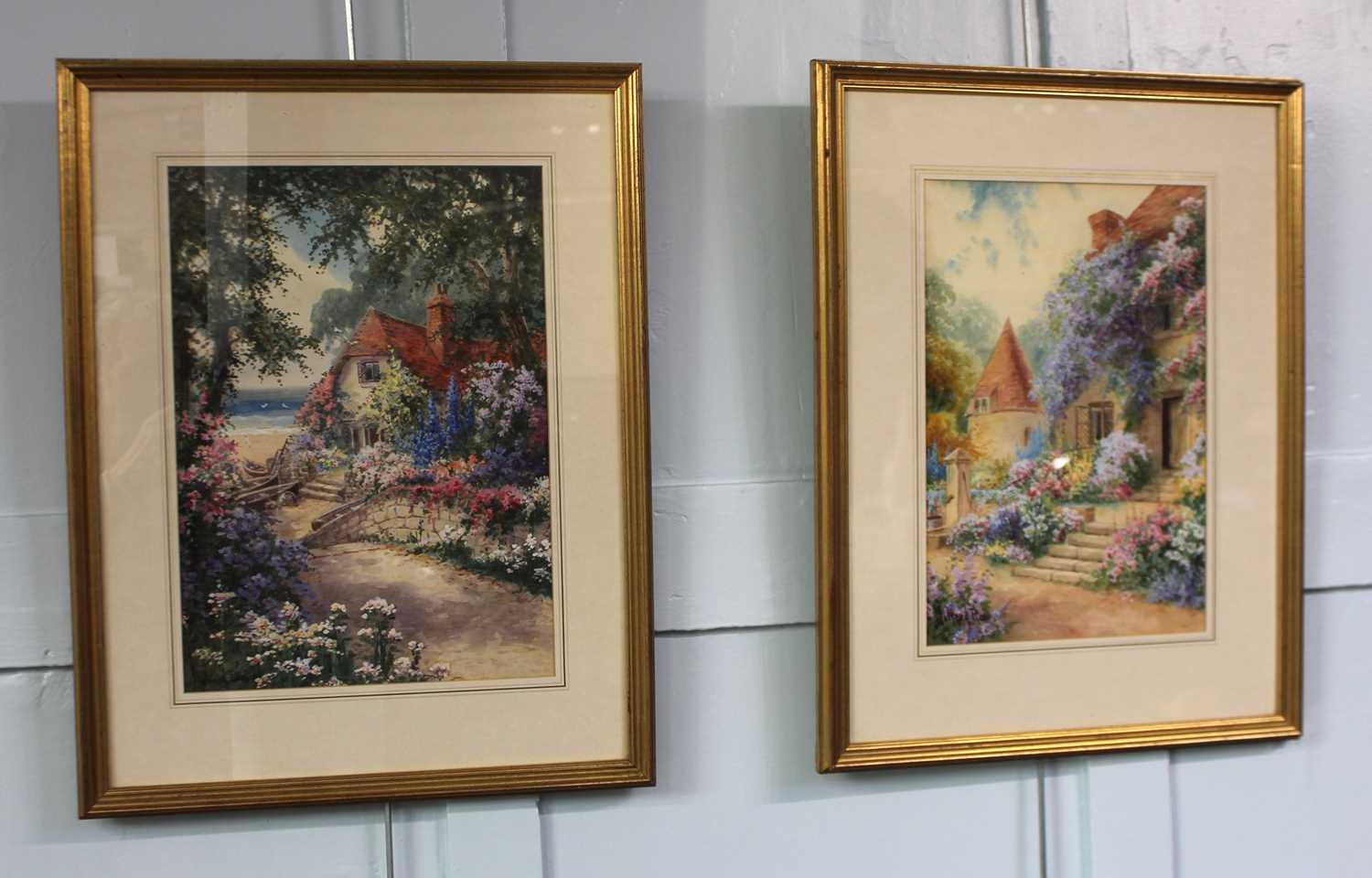 J Halford Ross, two watercolours depicting summer garden scenes with cottages, both signed 37cm by