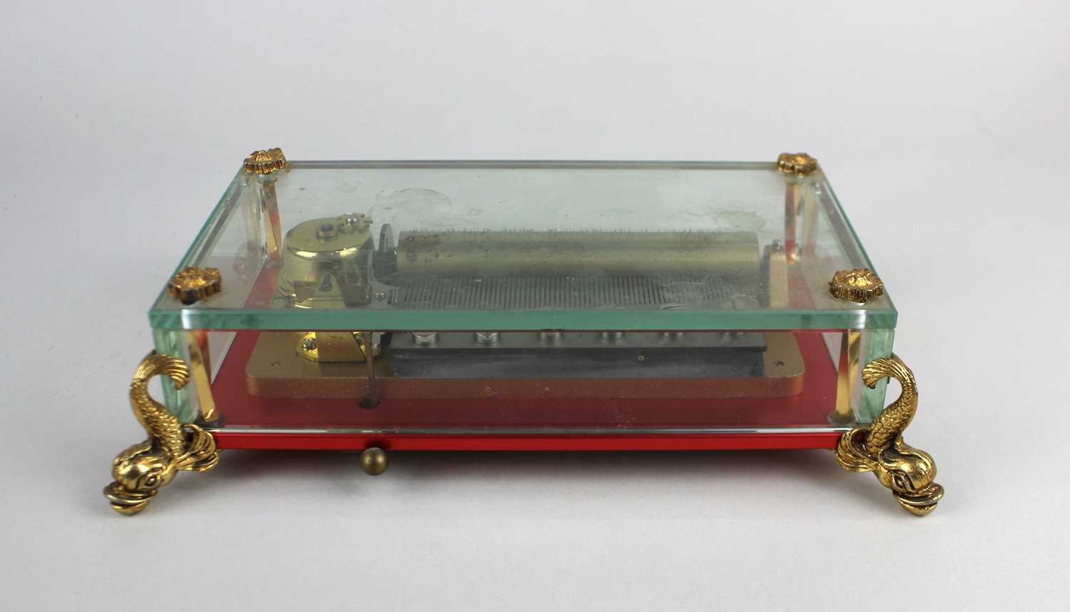 A mid 20th Century Reuge, Saint -Croix music box in glazed case with four metal feet in the form