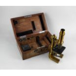 A brass microscope by E Leitz Wetzlar No 13447, with accessories, in fitted case (a/f)
