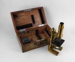 A brass microscope by E Leitz Wetzlar No 13447, with accessories, in fitted case (a/f)