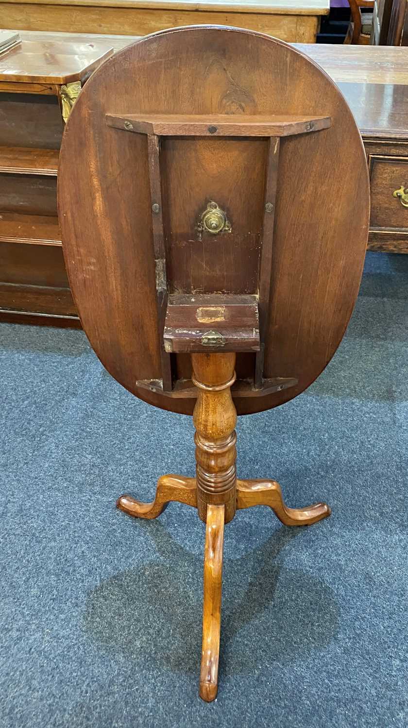 A 19th century mahogany side table, the oval tilt-top on turned column to outswept tripod legs - Image 2 of 2