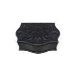 An ebonised wooden box possibly Anglo-Indian, with floral carved lid 30cm (a/f)