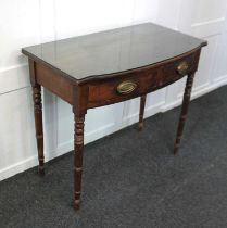 A 19th century mahogany bowfront side table two drawers with brass oval drop handles, on turned