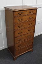 A mahogany narrow chest of seven graduated drawers on bracket feet 119cm wide by 59cm high