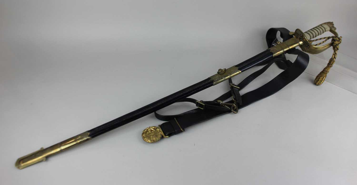 A British Naval Officers dress sword by Friedeberg, with knot, etched blade numbered 2440, in