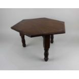 A small mahogany hexagonal occasional table or plant stand on three turned legs 46cm