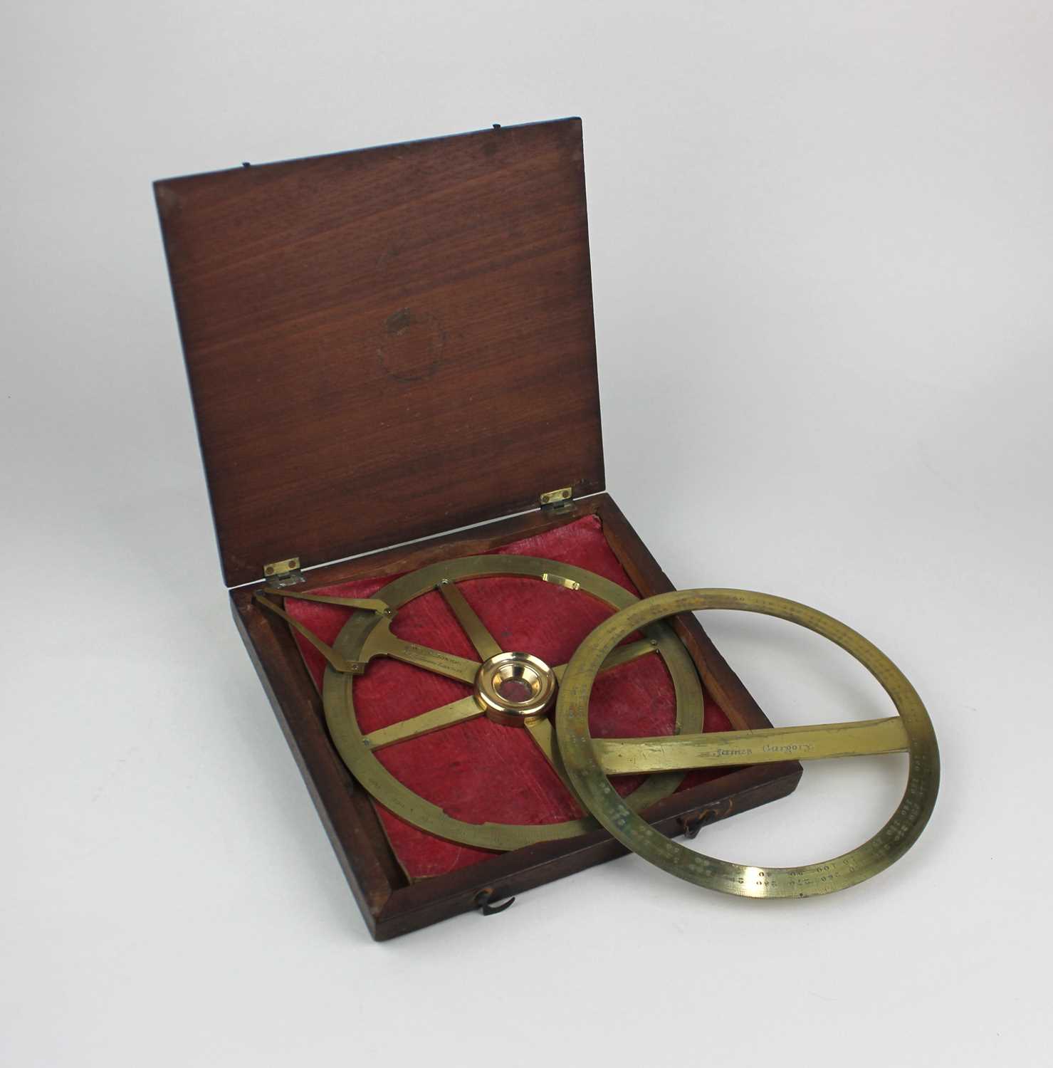 A brass circular protractor by W & S Jones 30 Holborn London, in fitted case, and a brass protractor