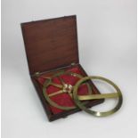 A brass circular protractor by W & S Jones 30 Holborn London, in fitted case, and a brass protractor