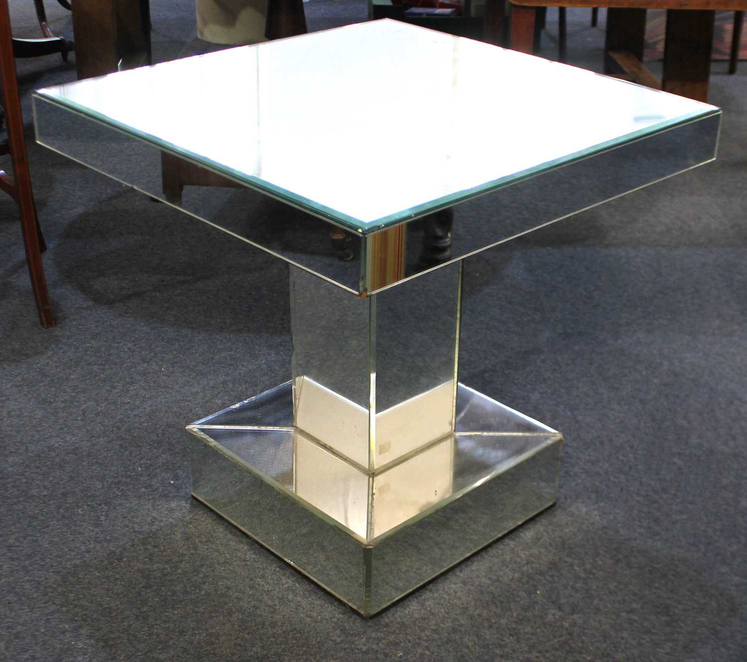 A vintage Art Deco design mirrored side/cocktail table the bevelled square top raised on a