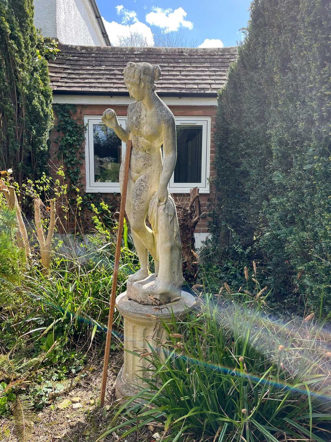 A composite stone garden statue of a classical nude figure on associated column base 196cm high - Image 2 of 3