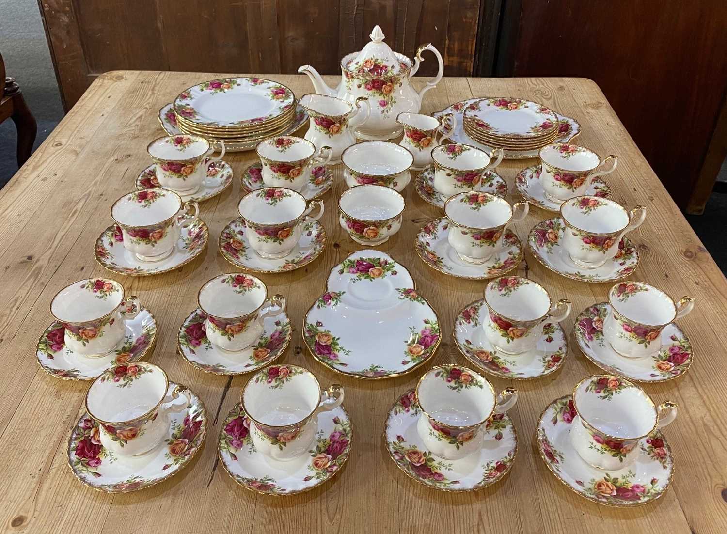 A Royal Albert Old Country Roses porcelain part tea and dinner service comprising teapot 22cm,